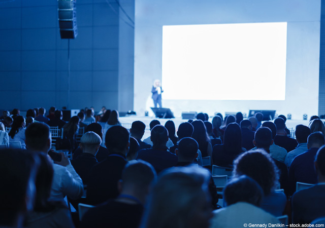 Speaker giving a talk in conference hall at business event [© Gennady Danilkin – stock.adobe.com]